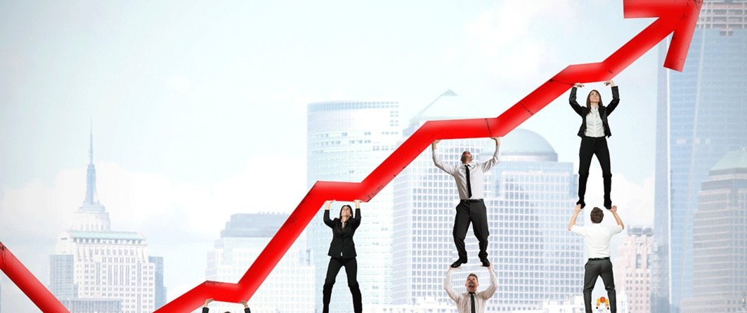 Team lifting a growth chart